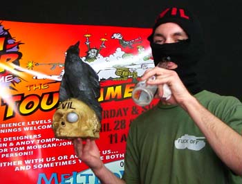 Balaclava dude wins a motion-sensitive bleeping raven on a skull just for being himself.
