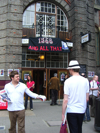 'Here, take a leaflet and please remove that stupid hat...'