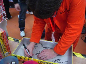 Andy S mid-signing.