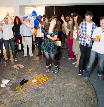 Banker Pinata! She went for it in such a frenzy that no one captured the first strike on film.