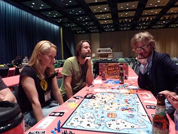 The first evening over in the game hall. Tom looks asleep aready, while Jason from Gorilla Games contemplates the game and Nicole (aka 'Killer') fixes her adversary with a deathly stare.