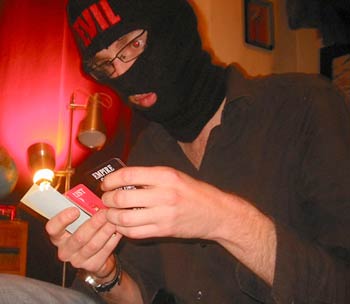 Tom's turn with the balaclava, studying those new cards