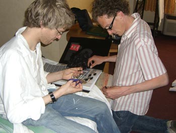 Tom and Andy T labeling cockroaches, a classic Vegas activity.