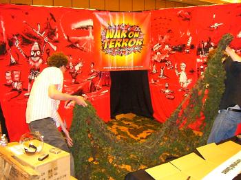 The camo netting floor goes down, to hide the nasty carpet.