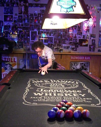 Andy T pulling off his famous 'war cry pool break'.