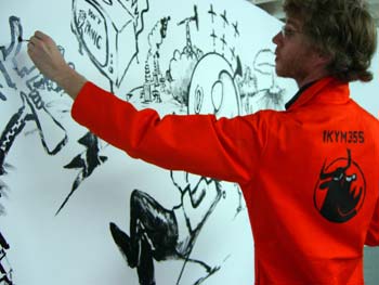 After a few nervous first strokes, Tom gets off to a flying start with his mural.