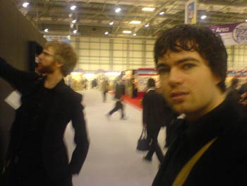 Looking a bit nervous while Tom tests the structural integrity of an internal booth wall