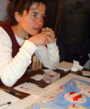 Ilaria looks shocked as Rich explains his plans for global domination.