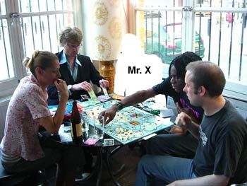 Bass diverts everyone's attention while Tom steals from the bank.