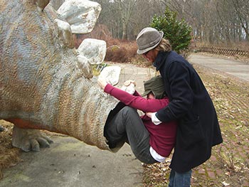 Tom helps Andy S into the stegosaurus. (That's a sentence I never thought I would write, ever)