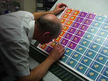 The careful eye of the printer checks for colour consistency