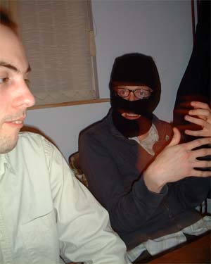 Andy T threatens Zak with strangulation, but Zak puts on a brave face.