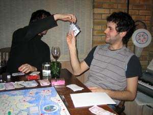 Mike tries to use the old double-bluff "that's a rubbish card to steal" grin.