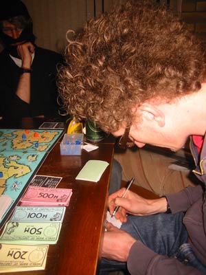 Andy T writes a secret message. Tom ponders.